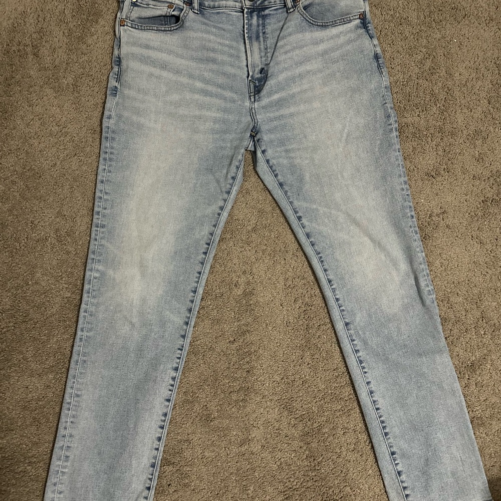 American Eagle Outfitters Tan Leather Patch on Light Blue Denim